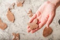 The process of making gingerbread. Hands cut gingerbread cookies closeup. Easter gingerbread dough, flour, rolling pin and copy sp Royalty Free Stock Photo