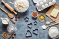 The process of making gingerbread heart on Valentine`s Day. Bake sweet cake dessert concept. Top view, flat lay style Royalty Free Stock Photo