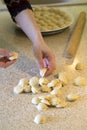 The process of making homemade dumplings. Ready raw dumplings in flour on the table Royalty Free Stock Photo