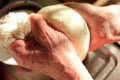 Process of making homemade ricotta cheese. Close-up of female hands with freshly made cottage cheese Royalty Free Stock Photo