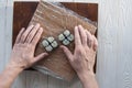 Process of making maki sushi. Cook chef hands preparing rolls with cheese, avocado and sesame seeds on wooden board Royalty Free Stock Photo