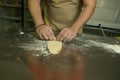 Healthy food concept. The process of making natural egg noodles. The hands of the chef prepare the dough for cutting Royalty Free Stock Photo