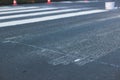 Process of making new road surface markings with a line striping machine, workers improve city infrastructure, demarcation marking Royalty Free Stock Photo