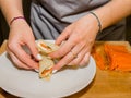 The process of making pancakes. Cook in the kitchen makes the dough