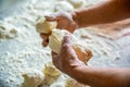 Process of making pies, hand. Hands pie dough. Dough for baking, pieces dough. Womans hands rolling doughs for pies Royalty Free Stock Photo