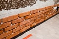 Process of making a red brick wall, home renovation Royalty Free Stock Photo