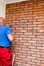 Process of making a red brick wall, home renovation Royalty Free Stock Photo