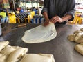 The process of making roti canai or knead bread at the local stall in Malaysia.