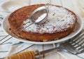 The process of making semolina pie with ingredients on a wooden background.Sprinkle cake with icing sugar.Food background