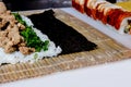 The process of making sushi, rolls. Wrapping sushi in a nori leaf Royalty Free Stock Photo