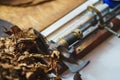 Process of making traditional cigars from tobacco leaves with own hands using a mechanical device and press. Royalty Free Stock Photo