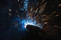 The process of manual welding. Industrial welding of iron construction elements.  Splashes of hot metal Royalty Free Stock Photo