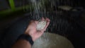 The process of milling unhusked rice into rice at a rice mill,