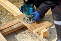 The process of milling wood with a circular machine. Passion for wood carving. Golden hand