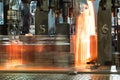 Process of movement of hot glass bottles on the conveyor Royalty Free Stock Photo