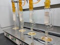 The process of obtaining oil content from kernal palm seeds is done in a laboratory