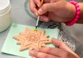Process of painting child of pottery star