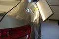Process Of Paintless Dent Repair On Car Body. Big Dent On Rear Car Fender. PDR Removal Course Training.