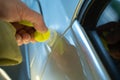 Process Of Paintless Dent Repair On Car Body. Technician s Hands With Puller Fixing Dent On Rear Car Fender. PDR Removal
