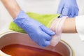 Process paraffin treatment of female hands Royalty Free Stock Photo