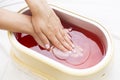 Process paraffin treatment of female hands Royalty Free Stock Photo