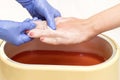 Process paraffin treatment of female hands Royalty Free Stock Photo