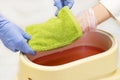 Process paraffin treatment of female hands Royalty Free Stock Photo