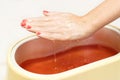 Process paraffin treatment of female hands Royalty Free Stock Photo