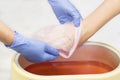 Process paraffin treatment of female hands Royalty Free Stock Photo