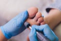 Process pedicure close-up, polishing feet, unrecognizable people. blurred face.