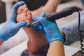 Process pedicure close-up, polishing feet, unrecognizable people. blurred face.