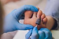 Process pedicure close-up, polishing feet, unrecognizable people. blurred face.