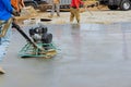 The process of polishing and leveling cement screed mortar floors on the construction site in the process of