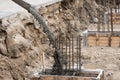 The process of pouring concrete into the formwork with rebar. Construction site, details Royalty Free Stock Photo