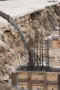 The process of pouring concrete into the formwork with rebar. Construction site, details Royalty Free Stock Photo