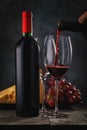 Process of pouring red wine in a glass Royalty Free Stock Photo