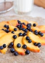 Process of preparing biscuits with peach and blueberry