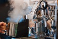 Barista making coffee at small cafe. Royalty Free Stock Photo