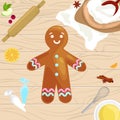 Process of preparing Christmas treats and sweets on a wooden kitchen table. Gingerbread man and ingredients for cooking