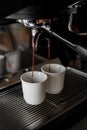Process of preparing fresh fragnant espresso with rich taste on professional coffee machine in coffeeshop or cafe Royalty Free Stock Photo