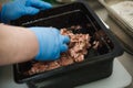 The process of preparing meat products.