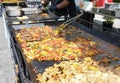 The process of preparing a quesadilla, traditional Mexican dish. Outdoor outside setting