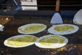 The process of preparing a quesadilla, traditional Mexican dish. Outdoor outside setting