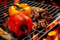 Process of preparing red and yellow bell pepper, zucchini, champignons on barbecue bbq grill. Flaming fire, ember