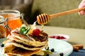 Process of preparing sweet delicious pancake blinis with jam and Royalty Free Stock Photo