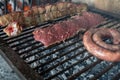 Process of preparing a typical Argentinian Asado with beef and sausage