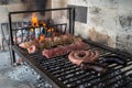 Process of preparing a typical Argentinian Asado with beef and sausage