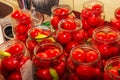 The process of preserving tomatoes for the winter. Ripe red juicy tomatoes in glass jars