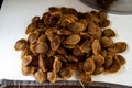 The process of producing apricot jam at home. Pits from freshly peeled apricots