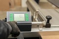 The process of programming a CNC machine. Entering data into a computer controlled machine. CNC machine operator enters data Royalty Free Stock Photo